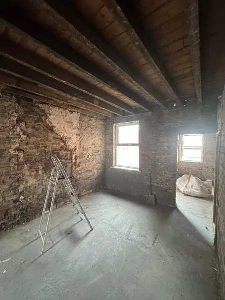 Room stripped to its underlying surfaces